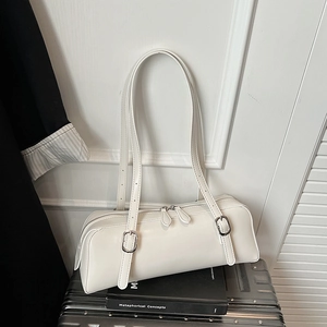 Close-up of white PU leather Boston bag with dual zippers and silver-tone hardware