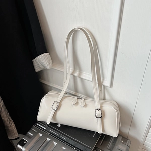 Detail showing silver buckle and double zippers on the white matte PU leather bag