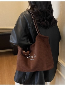 Brown suede tote bag with white letter embroidery and a detachable small pouch charm