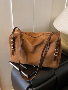 Brown suede leather tote bag with stylish gold buckles and long shoulder straps
