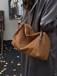 Brown suede tote bag with leather straps and minimalist soft slouchy style