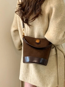 Retro dark brown suede bucket bag with leather strap and golden fashion hardware