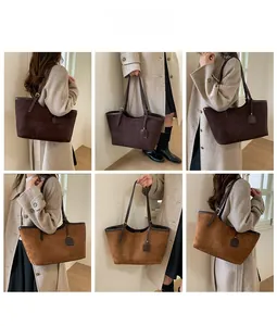 Detail view of suede tote bags in dark brown and caramel showing the soft matte texture