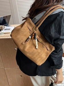 Brown suede bucket bag with vintage wooden beads and shoulder strap for women