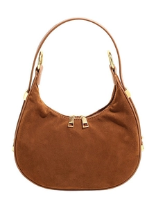 Chic brown suede hobo bag with gold zippers and leather strap on a white background