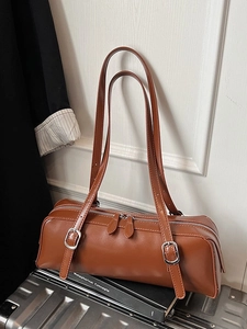 Chic brown faux leather cylindrical shoulder bag with double zippers and long straps