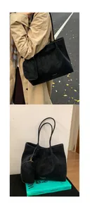 Détails d'un grand cabas noir avec pochette assortie et logo de marque minimaliste