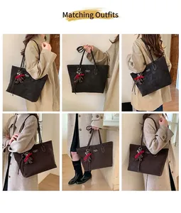 Detail view of a large coffee brown faux suede tote bag with a cute bear charm accessory