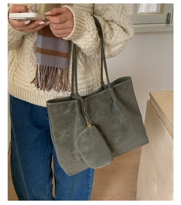 Detail view of large matte tote bag with contrast stitching and matching coin purse