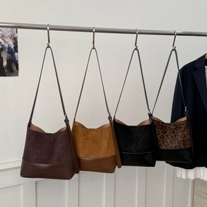 Various retro frosted suede tote bags in brown, black, and leopard print textures