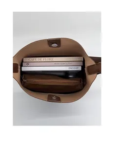Interior view of large capacity dark brown tote bag showing spacious storage for books
