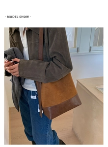 Brown retro bucket bag with adjustable shoulder strap shown on model for size and style