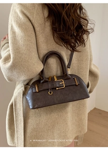 Minimalist retro boston bag in dark taupe faux leather with polished bronze hardware details