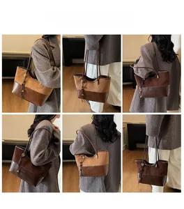 Detail view of brown vintage tote bag with dual-texture splicing and wooden bead tassel