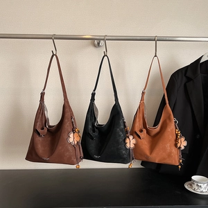 Large vintage hobo tote bag in coffee, black and caramel colors with beaded tassel