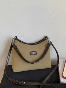 Retro khaki suede underarm bag with dark brown leather trim and dual shoulder straps
