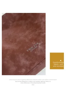 Close-up of caramel suede leather texture with white logo on a stylish tote bag
