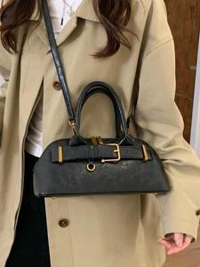 Minimalist black oil wax leather handbag for women featuring a vintage Boston bag style