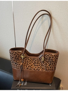 Fashion leopard print tote bag with brown leather base and beaded tassel charm