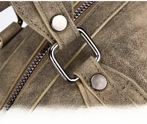 Close-up of vintage brown tote bag with antique silver hardware and durable metal rivets