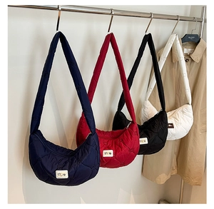 Quilted crossbody bags in four colors featuring heart stitching and a SOME logo patch