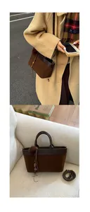 Detail of dark brown suede tote bag with leather straps and beaded tassel charm