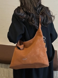 Vintage brown shoulder tote bag with bead charms and COIH'2DN LONDON logo print