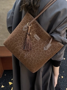 Retro leopard print tote bag with suede texture and tassel detail for daily commute