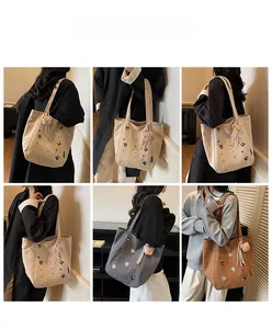 Detailed views of canvas tote bag in multiple colors featuring cute animal embroidery