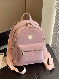 Sac à dos rose pour femme avec imprimé léopard, fermetures dorées et poches latérales pratiques