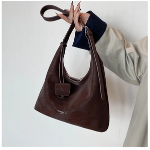Close-up of the brand logo on a dark coffee matte leather Hobo shoulder bag for women