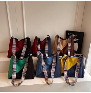 Detailed texture of corduroy tote bags with ethnic style colorful woven shoulder straps