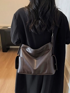 Deep coffee large capacity shoulder bag for women with adjustable strap in minimalist room
