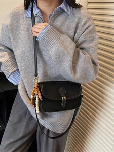 Retro black frosted crossbody bag with vintage charm and beaded tassel accessory