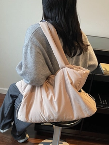 Quilted nylon tote bag for women in pale pink, featuring a large capacity shoulder design
