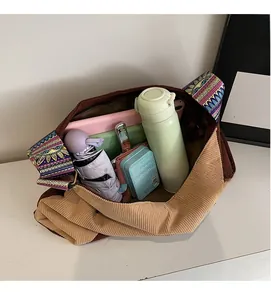 Interior view of large corduroy tote bag showing spacious room for daily essentials