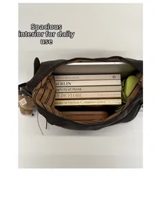 Detailed view of spacious interior storage for laptop and books in dark brown tote bag