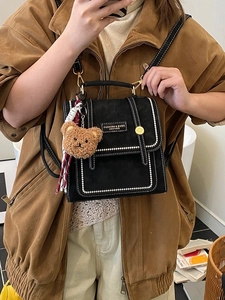 Vintage black mini backpack in suede leather with contrast stitching and bear charm