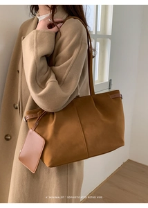 Detail of caramel suede tote bag with matching mini pouch and decorative side ties