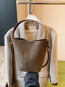 Olive green frosted leather bucket bag with brown leather handle and retro metal buckle