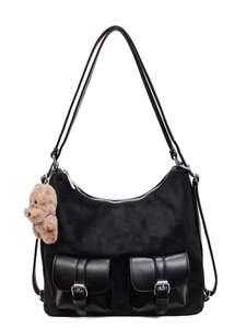 Large black hobo tote bag in suede finish with front pockets and teddy bear charm