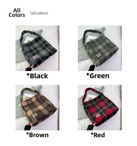 Detail shot of four vintage plaid tote bags in blue, green, brown, and red tartan fabric