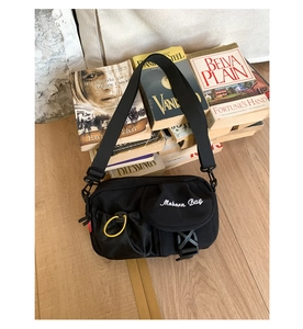 Close-up of waterproof nylon shoulder bag with Modern Bag embroidery and tactical buckle