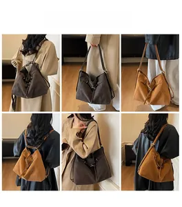 Detail view of versatile tote bags in dark brown and caramel with adjustable straps