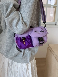 Retro American cargo style crossbody bag in purple patchwork with buckle and mesh pocket