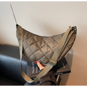Detailed view of the olive green quilted nylon hobo bag featuring a classic rhombus pattern