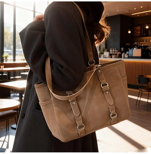Side view of a vintage brown large capacity tote bag with matte texture for daily work