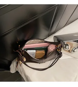 Interior view showing the large storage capacity of the dark brown leather tote bag
