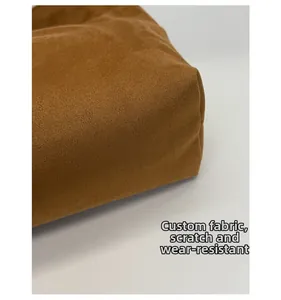 Close-up showing the scratch-resistant brown suede texture of the shoulder bag fabric