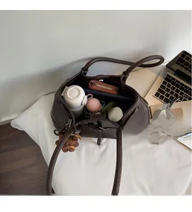 Top view of deep brown leather tote bag interior showing large storage capacity